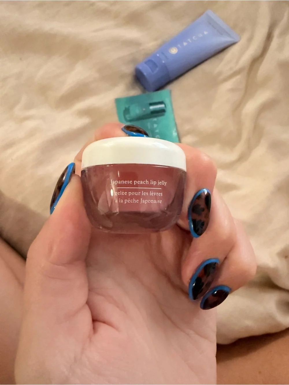 Tatcha skincare trio in lavender, teal & red